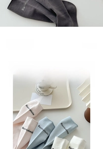 Detail of premium combed cotton socks with letter printing and ribbed knit texture