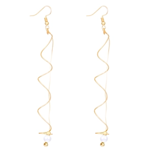 Detailed view of long gold spiral wave earrings with elegant hanging white pearls