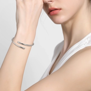 Minimalist S925 sterling silver open bangle with polished 3mm band on model wrist