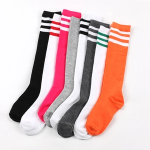 Detail of women's knee-high socks with triple stripes in various vibrant colors