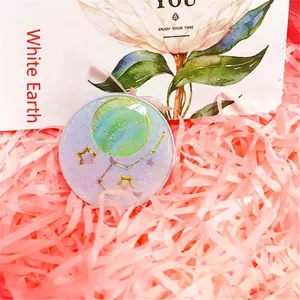 Planet themed expanding phone grip with earth design and glitter finish on pink background