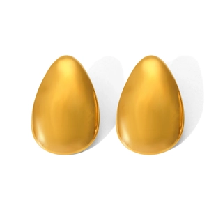 Close-up of teardrop gold titanium steel earrings with high polished reflective surface