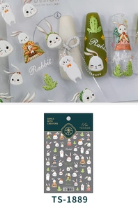 Macro detail of artistic rabbit and cactus nail stickers on nails with packaging