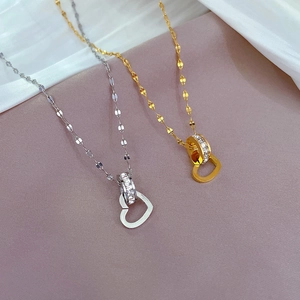 Interlocked heart and zircon ring pendant necklaces in gold and silver titanium steel