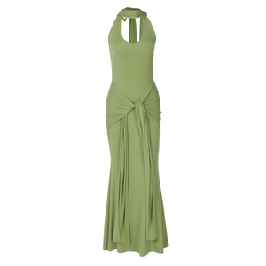 Detail view of green halter maxi dress featuring waist knot and flowing sash design