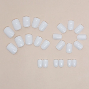 24 pieces of minimalist solid white short square press-on nails on beige background