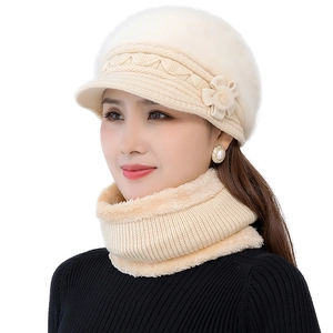 Close-up of knit winter hat and scarf set with thick plush lining and pearl floral detail