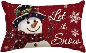 Close-up of red linen Christmas pillow cover with white Let it Snow print text
