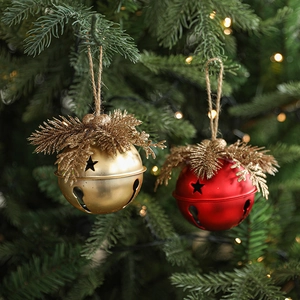 Christmas tree bells with star cutouts, pine needles, red berries and jute rope hangers