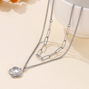 Double-layer stainless steel paperclip chain necklace with a hollow flower pendant