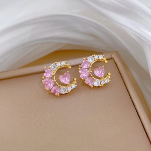 Golden crescent moon earrings with pink heart zircons in a premium jewelry box setting