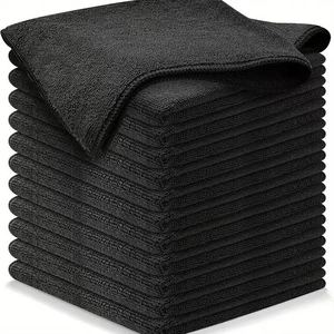 Stack of black microfiber cleaning cloths with high absorption and stitched edges
