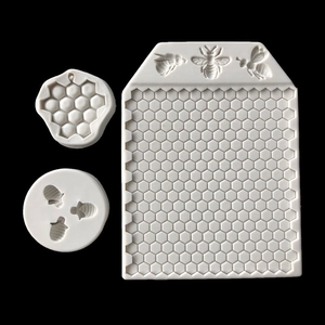 Detailed view of honeycomb texture silicone molds with bee relief for cake decoration