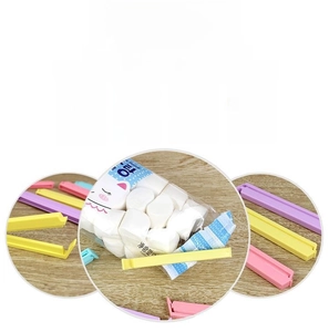 Detail of candy color food sealing clips showing various sizes and pastel plastic material