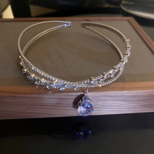 Detail of silver choker with double rhinestone bands and a large teardrop crystal pendant