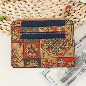 Detail of vintage cork card holder with floral pattern and secure metal zipper