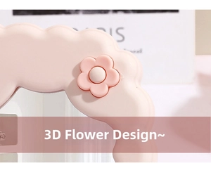 Close-up of pink wavy frame with a delicate 3D flower detail on the desktop makeup mirror