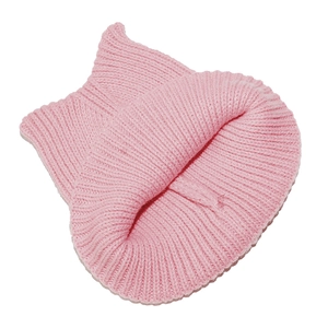 Close-up of pink ribbed knit beanie featuring cute cat ear design and soft texture