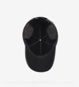 Detail view of the warm winter baseball cap featuring folding ear flaps and inner lining