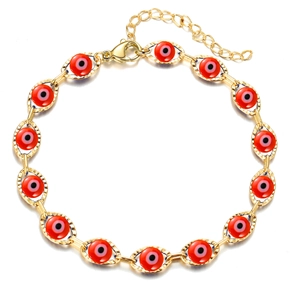 Detailed view of gold evil eye bracelet featuring red beads and lobster clasp closure
