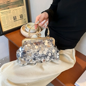 Vintage silver sequined chain shoulder bag with gold metal frame and ornate handle