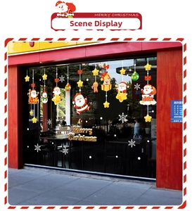 Detail of colorful Christmas window stickers with Santa Claus and reindeer on glass