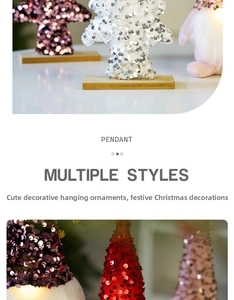 Macro detail of sequined Christmas gnome and tree with wooden base and light