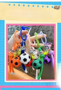 Macro detail of colorful football keychains with woven straps and metal lobster clasps