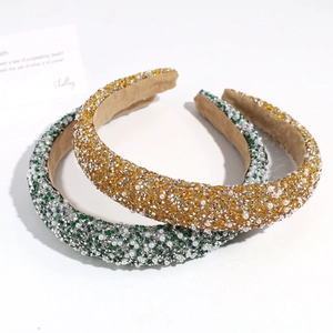 Sparkling rhinestone and faux pearl padded headband in gold and green vintage style