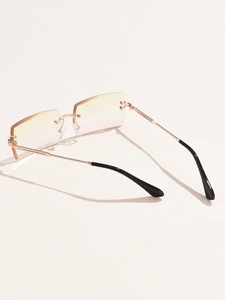 Detail view of rimless square sunglasses with yellow to pink gradient lenses and metal arms