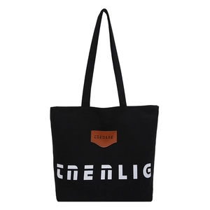 Large capacity black canvas tote bag with brown leather patch and shoulder straps
