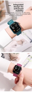 Close-up of waterproof LED digital watch display with heart icon and silicone strap