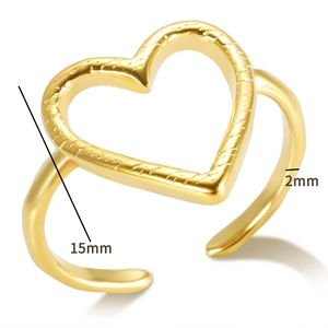 Detail view of gold open heart ring with 15mm textured heart and 2mm smooth band