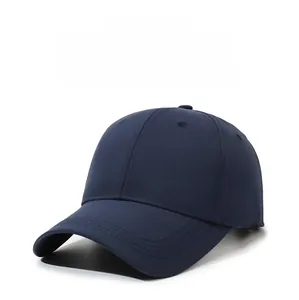 Close-up of navy blue 6-panel baseball cap with curved brim and breathable eyelets