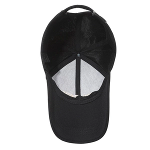 Inside view of black baseball cap showing cotton fabric, sweatband and metal buckle