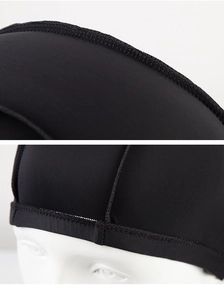 Detail view of reinforced stitching and durable fabric texture on black swimming cap