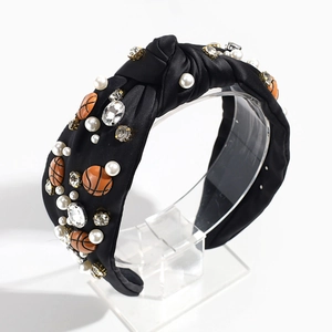 Detail of knotted headband with faux pearls, rhinestones and orange basketball charms