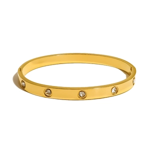 Golden titanium steel bangle with ten sparkling crystals in a classic geometric design