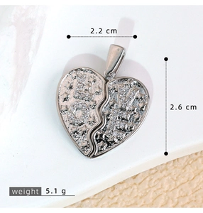 Detail of heart puzzle wings pendant with LOVE letters, stars, and dimension markings