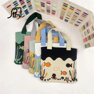 Detailed knit tote bags with colorful ocean-themed jacquard fish and octopus patterns