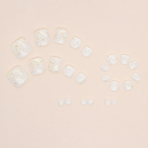Minimalist white press-on toenails with glittering gold foil accents in a square shape