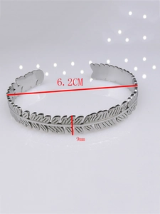 Detail view of silver feather cuff bracelet showing 6.2cm inner diameter and 9mm width
