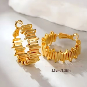 Chunky gold C-shaped hoop earrings with unique industrial textured block pattern 3.5cm