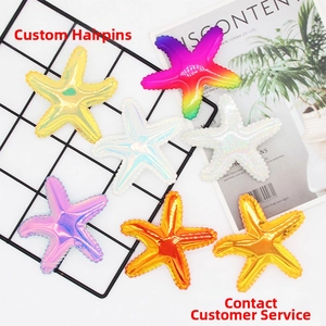 Flat lay of colorful starfish hair clips in glitter and metallic faux leather finishes