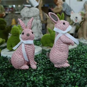 Pink resin rabbits with woven texture and white bows, garden decorative statues set