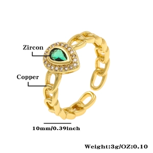 Detailed view of adjustable chain ring in copper with a green pear-cut zircon stone