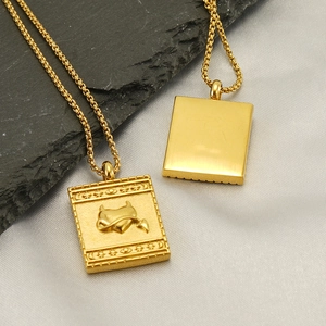 Gold plated stainless steel pendant necklace with vintage mystical heart embossing