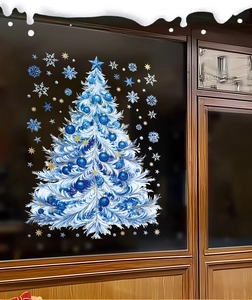 Close-up of blue Christmas tree and snowflake static window stickers on a glass door