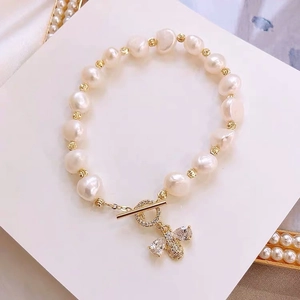 Baroque freshwater pearl bracelet with gold bee charm and OT toggle clasp closure