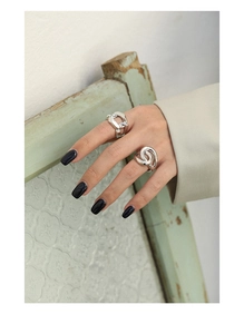 Close-up of S925 sterling silver chain link ring and multi-layered spiral band set